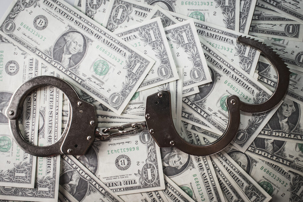 handcuffs and dollars